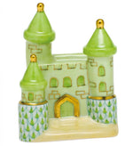 Herend Castle by Herend: a hand-painted ceramic figurine in green and gold, featuring three towers, arched windows, and patterned lower walls, displayed on a white background.