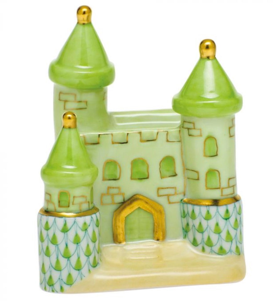 Herend Castle by Herend: a hand-painted ceramic figurine in green and gold, featuring three towers, arched windows, and patterned lower walls, displayed on a white background.