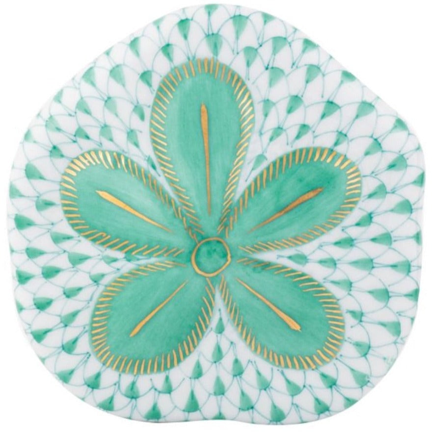 The Herend Puffy Sand Dollar ceramic plate features hand-painted green and gold floral designs on a white fish scale background, making it an ideal choice for art lovers.