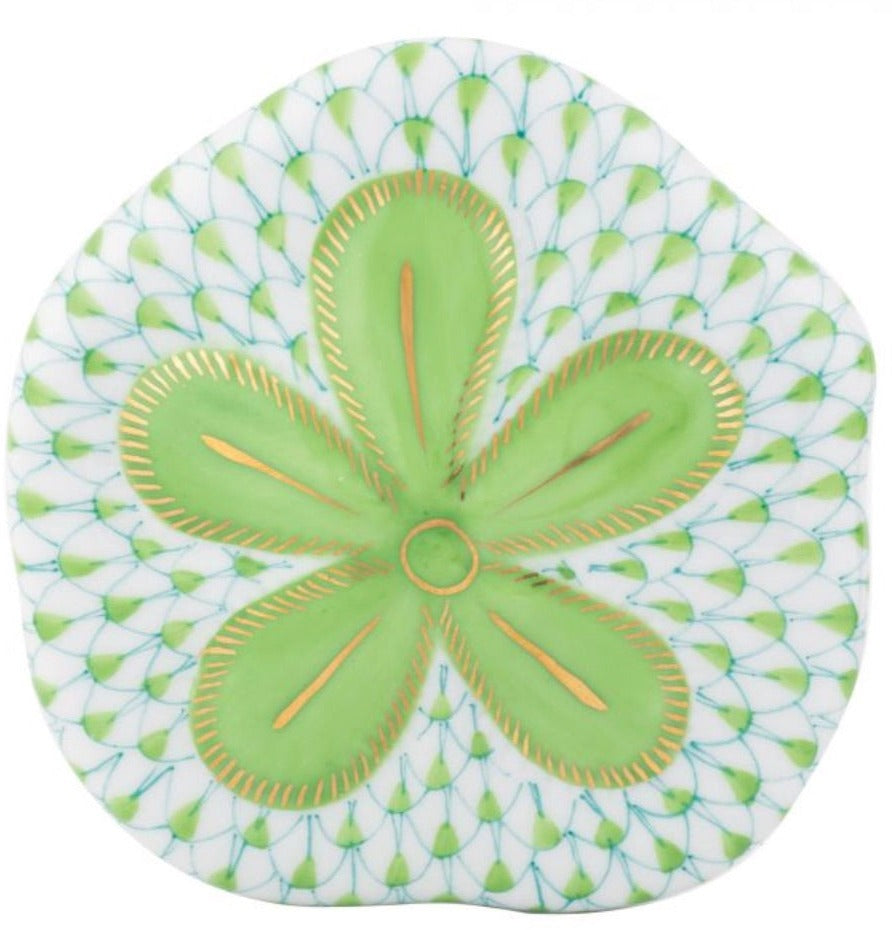 The Herend Puffy Sand Dollar is a decorative plate with hand-painted green and gold floral patterns, blue accents, and a white background—an exquisite piece for true artistic appreciation.