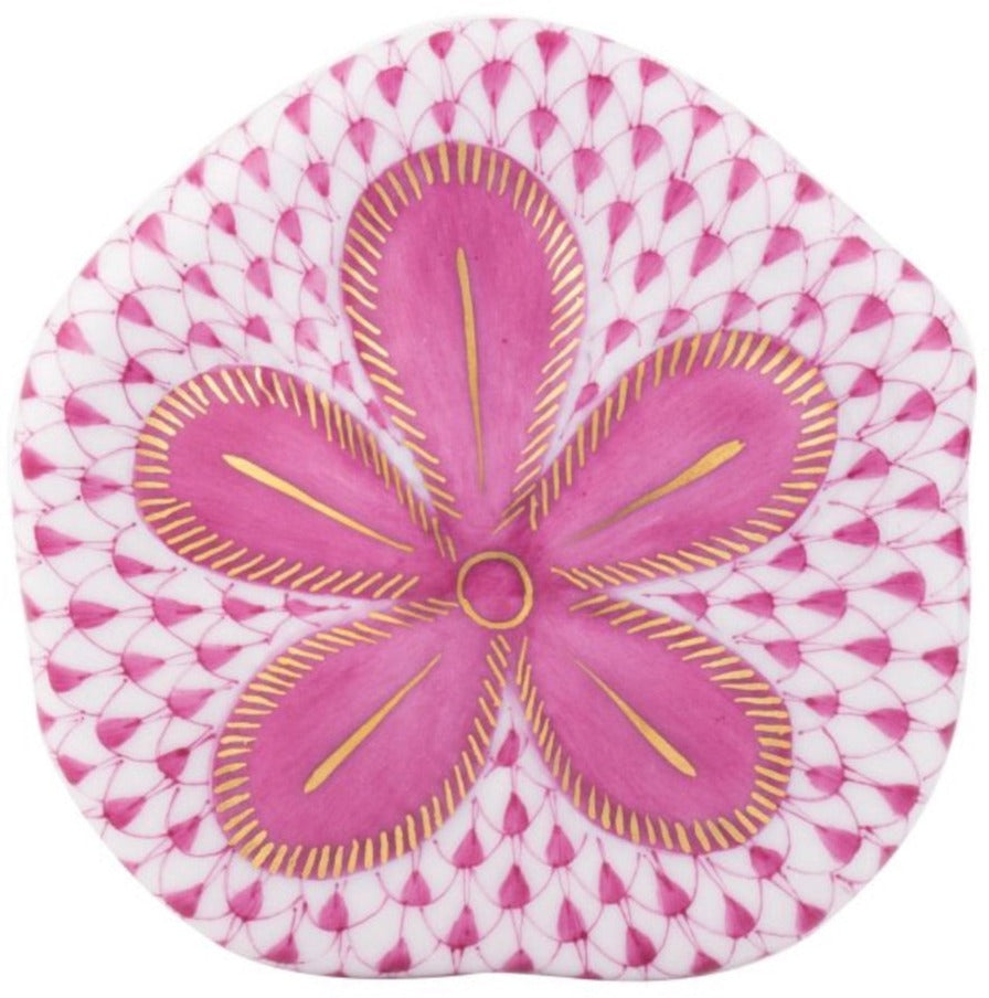The Herend Puffy Sand Dollar is a decorative piece with a pink and gold floral pattern over a textured, scale-like background—ideal for art lovers and fans of hand painted designs.