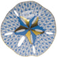 The Sand Dollar by Herend features a blue scallop pattern, gold and blue star-shaped center, and six oval cutouts—an exquisite hand-painted porcelain plate inspired by artistic tradition.