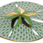 The Herend Sand Dollar porcelain plate features a hand-painted green and gold sand dollar motif with a patterned background and gold-rimmed edge—ideal for artistic display or collectors of fine porcelain.