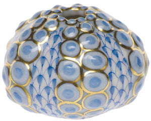 The Herend Sea Urchin is a round ceramic vase with blue circular patterns and gold accents, plus scale-like designs and a small top opening—perfect for displaying artistic hand-painted craftsmanship.