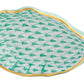 The Herend Oyster Shell is a green and white porcelain dish featuring a scallop shell shape, fish scale pattern, and gold-trimmed edge, presented against a white background.