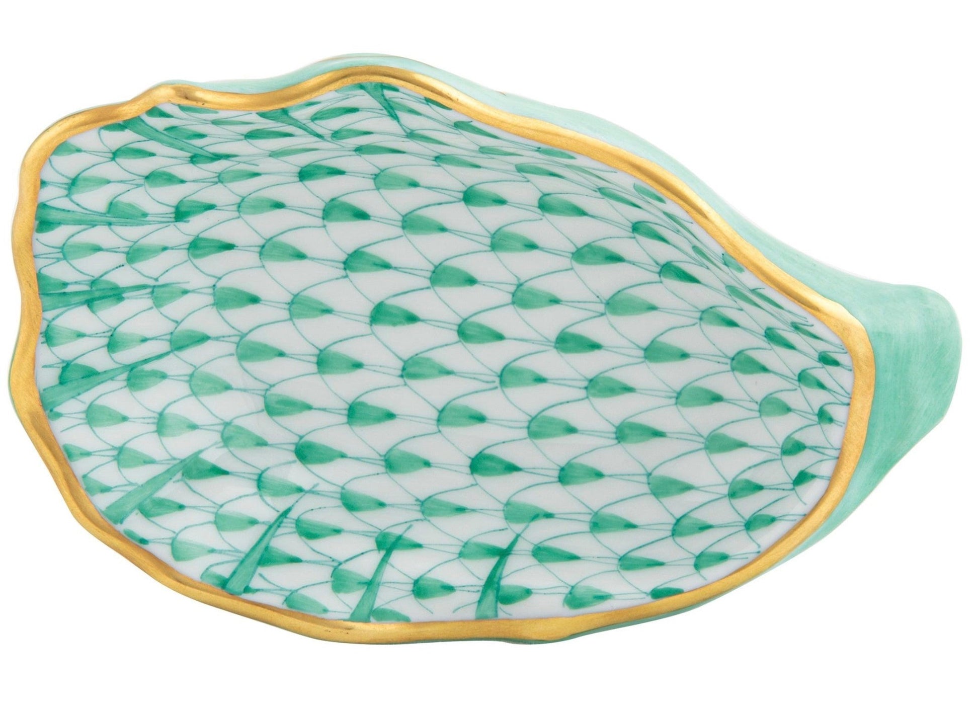 The Herend Oyster Shell is a green and white porcelain dish featuring a scallop shell shape, fish scale pattern, and gold-trimmed edge, presented against a white background.