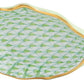 The Herend Oyster Shell is a ceramic dish shaped like a shell, hand painted in green and turquoise scale patterns, and finished with an elegant gold rim.