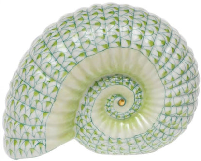 A hand-painted green and white Herend Ammonite Nautilus porcelain shell figurine on a white background.