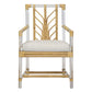 The Acrylic and Rattan Arm Chair by Selamat is a bamboo chair with a cushion, featuring an intricate backrest design, armrests, and clear acrylic frames on the sides. It is reminiscent of a Sea Cliff rattan armchair and upholstered in luxurious Kravet Crypton Boucle Fabric for added comfort and durability.