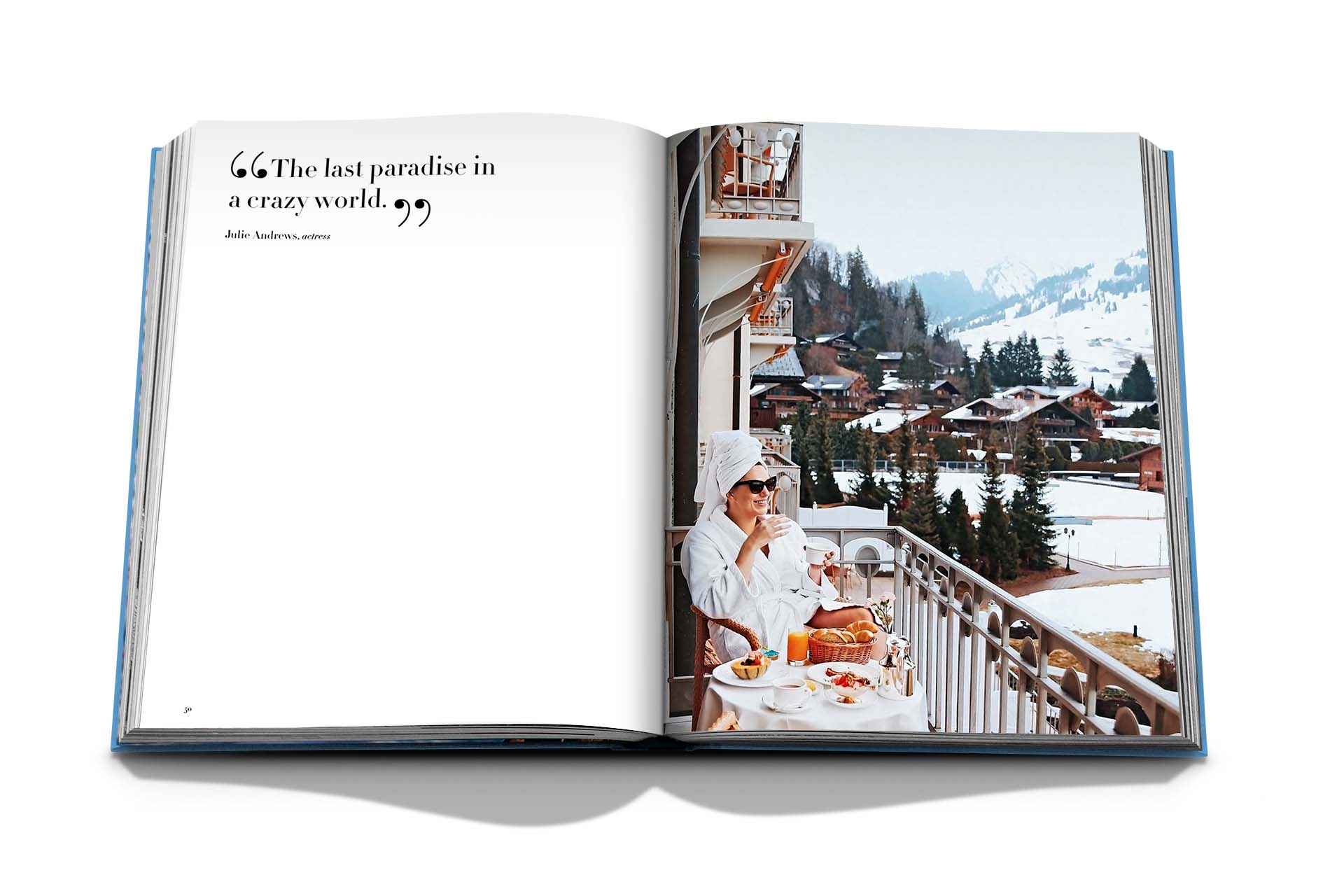 Open book with a quote on the left page and a photo on the right page of a person dining on a balcony overlooking the snowy village of Gstaad in the Swiss Alps. Product: Gstaad Glam by Assouline.
