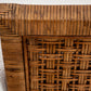 Close-up of McGuire Furniture's St. Germaine Chair showcases the exquisitely crafted woven wicker backrest, elegantly complemented by a light textured cane wrap surface.