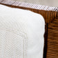 A beige woven cushion sits gracefully on the brown wicker frame of McGuire Furniture's St. Germaine Chair, highlighting its elegant cane wrap detailing.