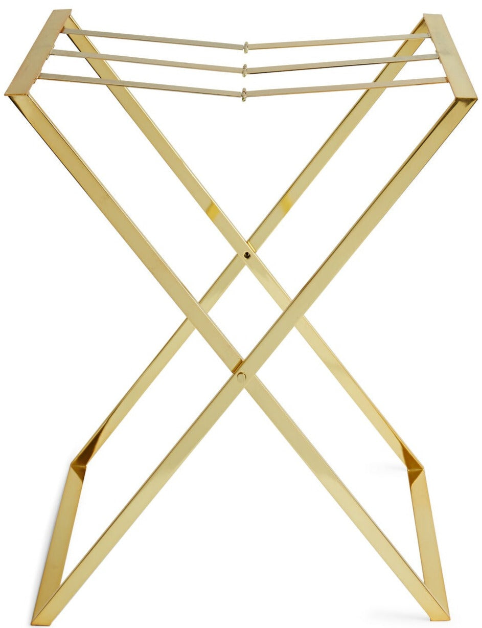 The Aerin Butler Tray Stand is a gold metal luggage rack with an X-shaped frame and three top support straps, perfect for entertaining at home or as a stylish brass stand for guests’ bags.