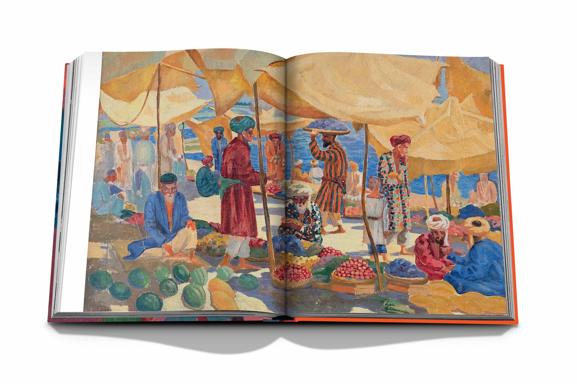 An open book titled "Uzbekistan: Avant-Garde Orientalists" by Assouline reveals a colorful painting of a bustling market scene, teeming with vibrant vendors, fruits, and tents.