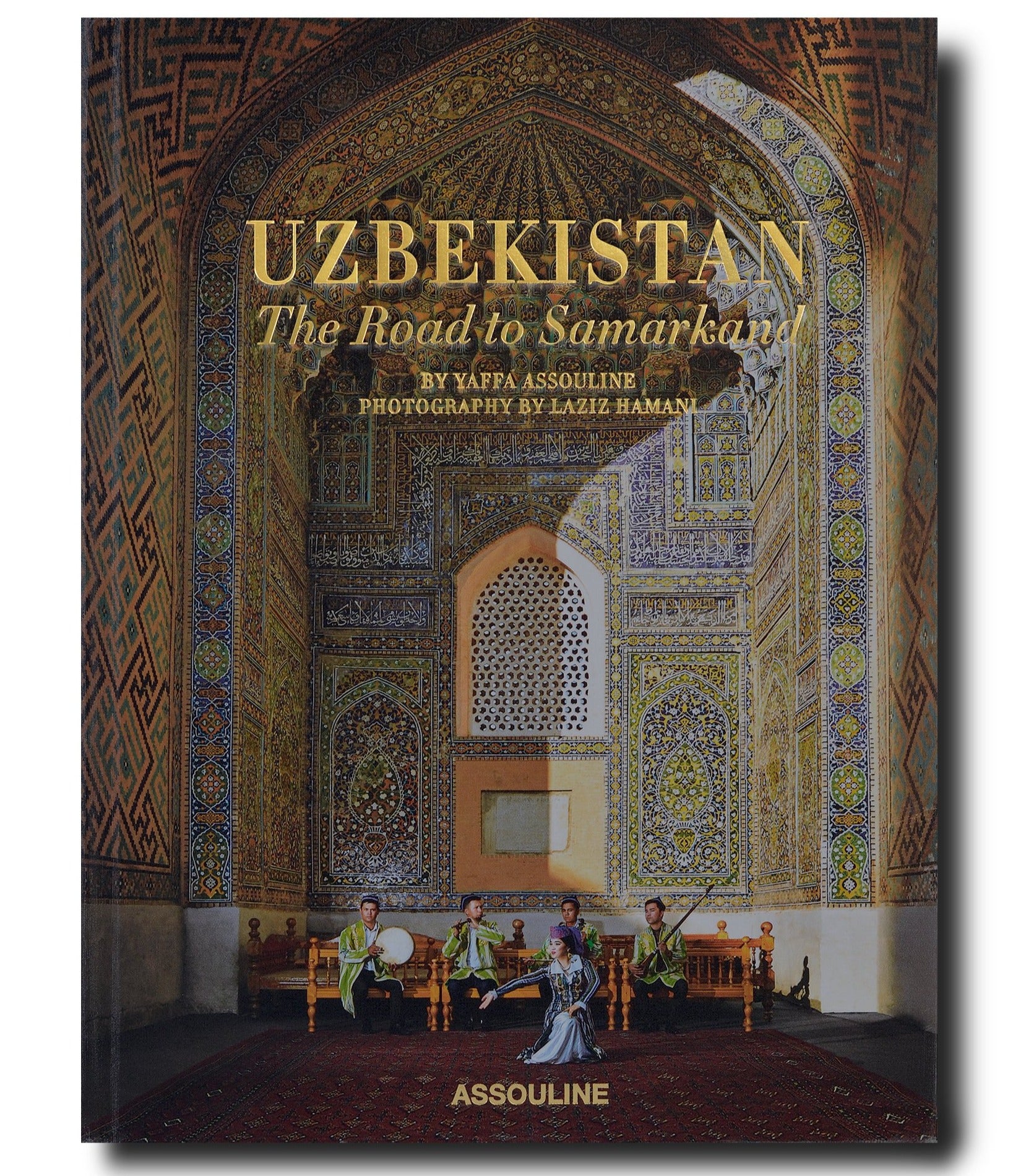 Front cover of a book titled "Uzbekistan: The Road to Samarkand" by Assouline with photography by Laziz Hamani, featuring a group of musicians in traditional costumes.