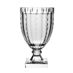 The Vivien Square Footed Vase, 12", by William Yeoward Crystal features a clear, faceted trophy cup with a wide bowl and square base. Its elegant design blends traditional and modern styles, beautifully refracting light against a white background.