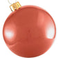 A glossy red Holiball Giant Inflatable Ornament, featuring a vintage design with a gold cap and hanging loop, enhances the charm of your holiday decorations.