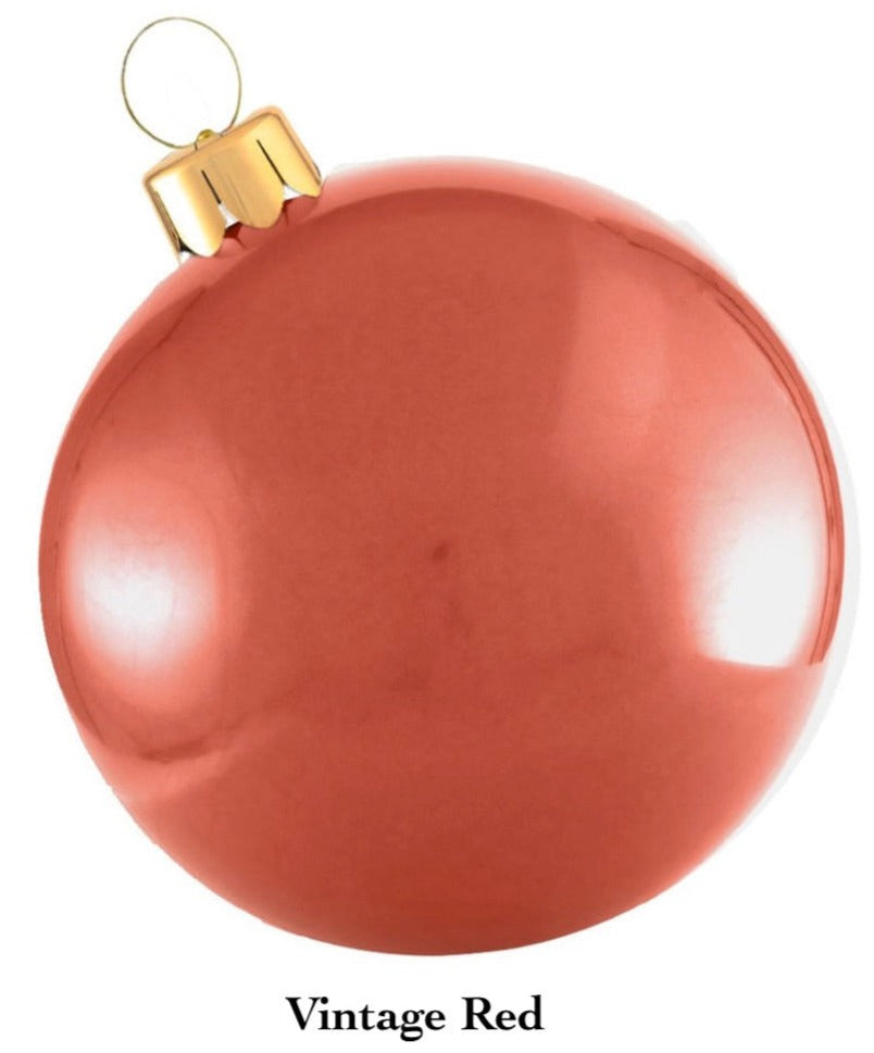 A glossy red Holiball Giant Inflatable Ornament, featuring a vintage design with a gold cap and hanging loop, enhances the charm of your holiday decorations.