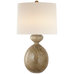 A Gannet table lamp by Visual Comfort with a rounded, textured base in a light beige color and a plain, large white lampshade. Its height adds an elegant dimension to its design.