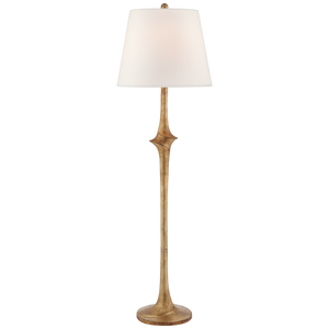 A Visual Comfort Bates Large Sculpted Floor Lamp in Gilded Iron with a slender bronze base and a simple linen shade.