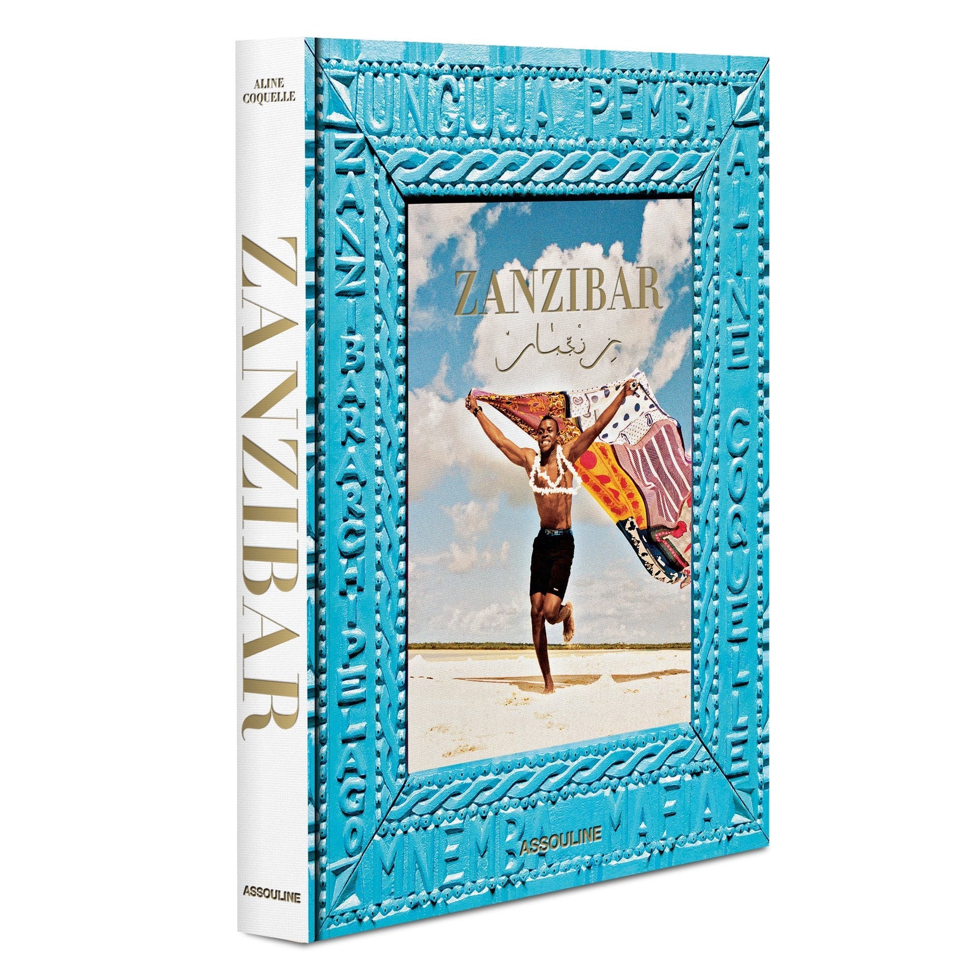 A book titled "Zanzibar" by Assouline with a photograph of a person running on a beach by the Indian Ocean while holding a flag on the cover. The book features a blue decorative border.