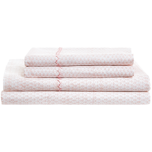 A neatly folded stack of the John Robshaw Poseti Lotus Sheet Set in light pink and white organic percale cotton, featuring a subtle decorative trim—an ideal layering essential for your bed.