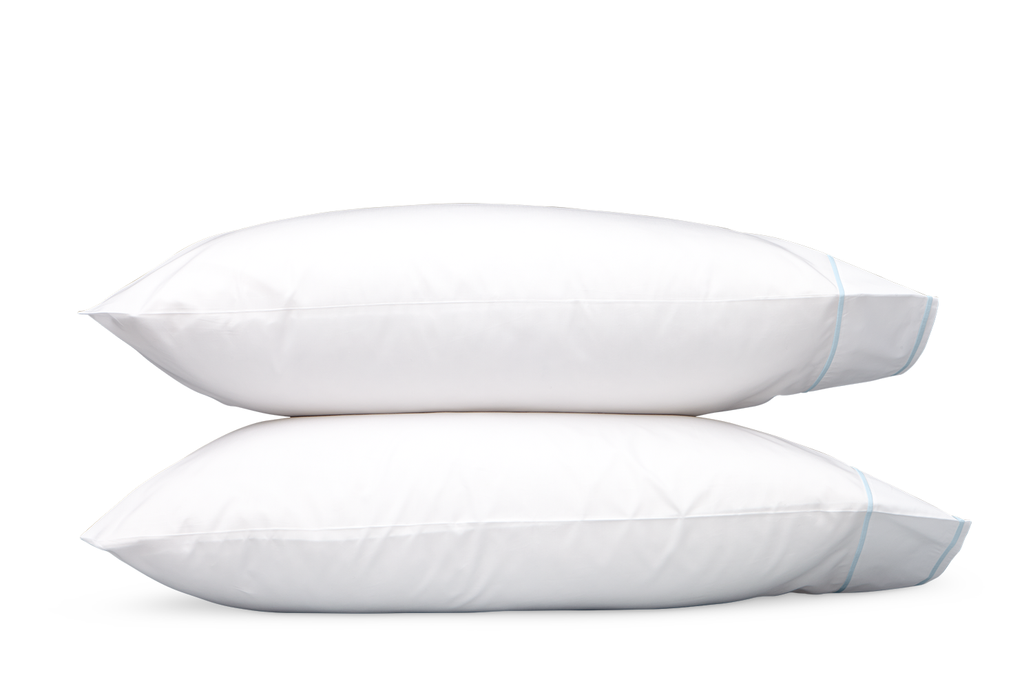 Two blue pillows from the Matouk Ansonia Bedding Collection are stacked on top of each other against a plain gray background.