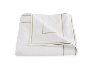Matouk Ansonia Bedding Collection, Almond duvet cover neatly folded on a white background, featuring a subtle tan border trim and crafted from Luca 500 thread count Egyptian cotton percale.