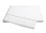 A folded white bedsheet from the Ansonia Bedding Collection by Matouk, made of luxurious Egyptian cotton percale with two light beige stripes near the edges, shown on a plain white background in the Almond color.