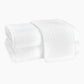 Two folded Auberge Monogram Bath Towels by Matouk, crafted from white cotton terry and embroidered with a "P", are stacked atop each other—perfect for the guest bath—against a plain white background.
