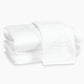 Two white Matouk Auberge Monogram Bath Towels are stacked neatly, ideal for the guest bath, with the top towel featuring an embroidered letter "Z".