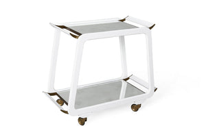 A white, two-tiered Austrian Bar Cart, White Gesso with a glass top and bottom shelf. The cart features a sleek white gesso frame, four small wheels for easy mobility, and angled handles on each side by Mr Brown.