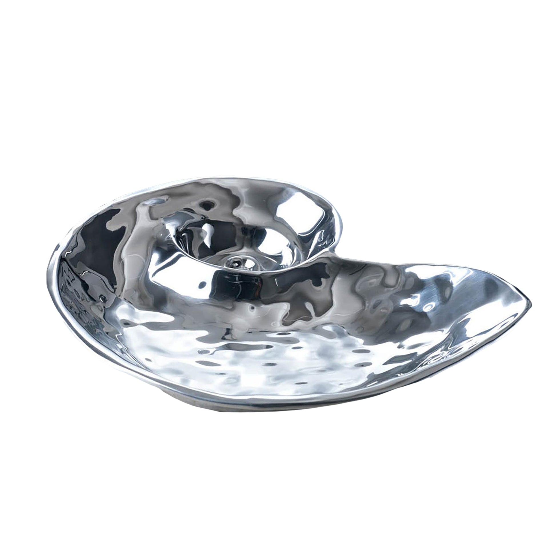 The Beatriz Ball Ocean Nautilus Dip is a shiny, metallic shell-shaped bowl with a hammered texture, expertly crafted from sandcast metal and displayed on a white background.