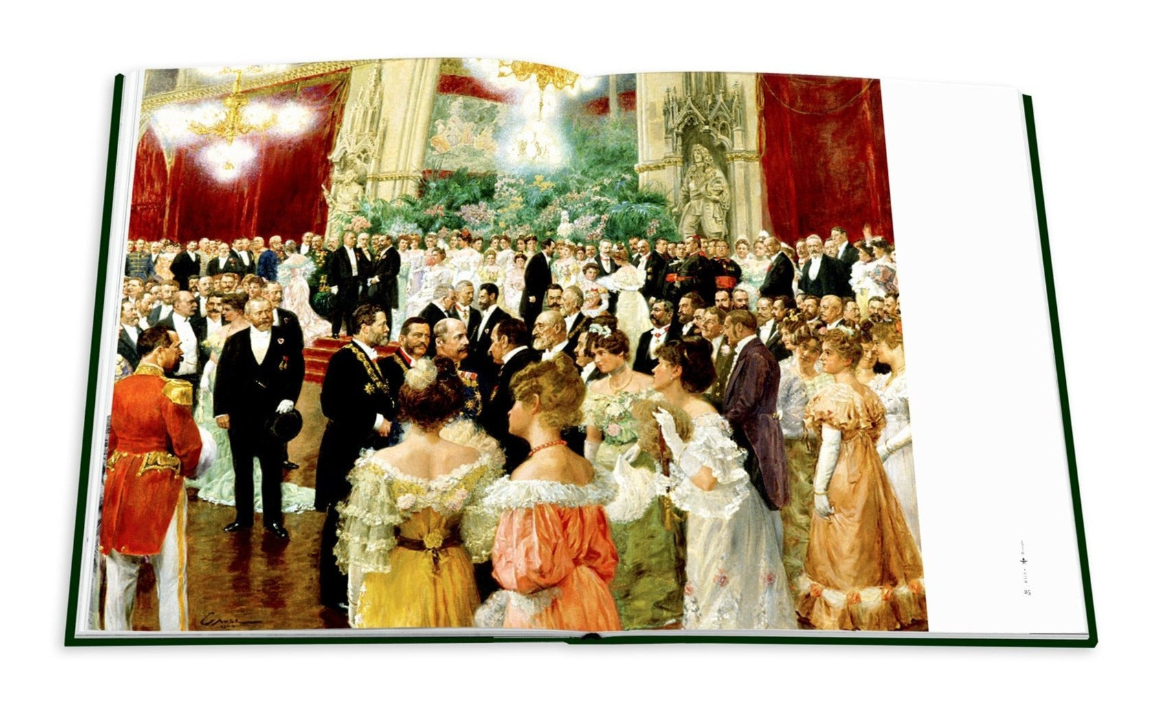 The open book "Legendary Costume Balls of the Twentieth Century" by Assouline reveals a painting of a formal ballroom, echoing Art Deco Paris, with elegantly dressed people conversing amid chandeliers and red drapery.