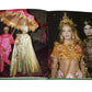 A spread in the Assouline photo book, "Legendary Costume Balls of the Twentieth Century," shows two images: on the left, people wear colorful attire echoing Romanov elegance; on the right, a couple dons jewel-encrusted costumes apt for lavish Art Deco Paris parties.