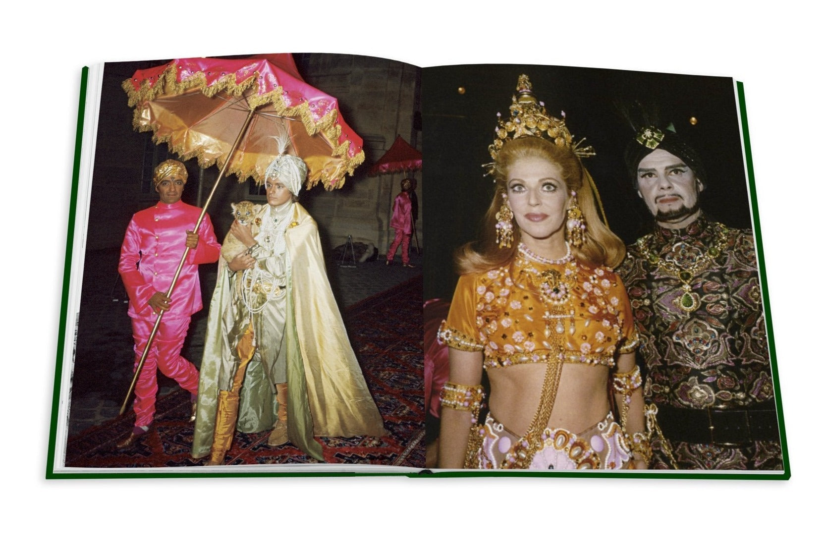 A spread in the Assouline photo book, "Legendary Costume Balls of the Twentieth Century," shows two images: on the left, people wear colorful attire echoing Romanov elegance; on the right, a couple dons jewel-encrusted costumes apt for lavish Art Deco Paris parties.