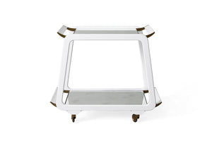 A white, two-tiered Austrian Bar Cart, White Gesso by Mr Brown with a square gesso frame and gold accents, featuring a glass top shelf and aged mirror bottom shelf, on four caster wheels.