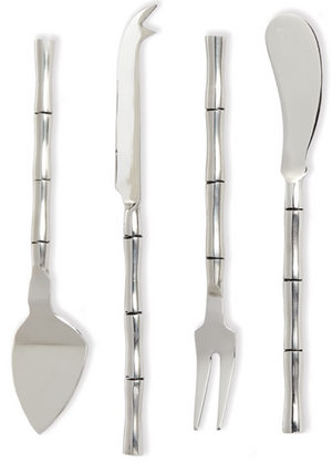 The Napa Home & Garden Grove Cheese Knives set includes four kitchen accessories with bamboo-style handles: a spade, knife, fork, and spreader, all shown vertically on a white background.