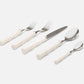 The Blue Pheasant Montecito Acrylic Ivory 5 Piece Flatware Set features a dinner fork, salad fork, knife, soup spoon, and teaspoon with textured ivory handles—dishwasher safe and elegantly arranged on a light background.