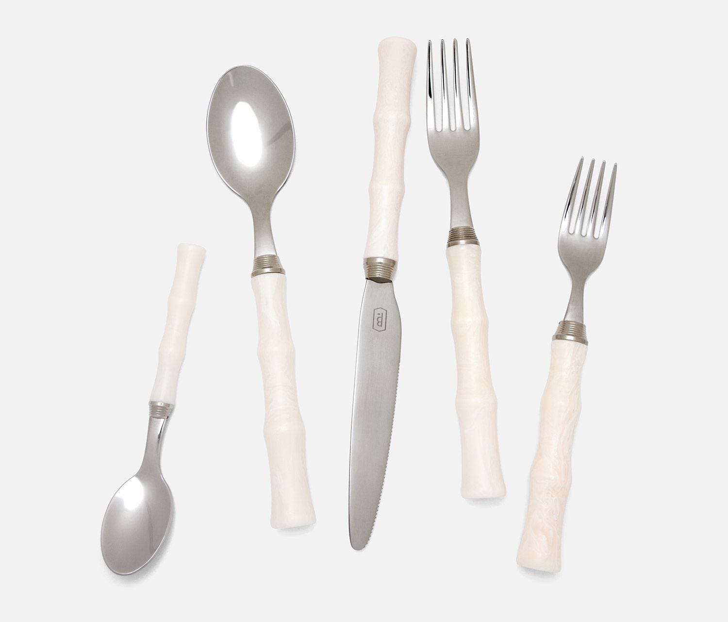 The Blue Pheasant Montecito Acrylic Ivory 5 Piece Flatware Set includes two forks, two spoons, and a knife, beautifully arranged on a white background. These dishwasher safe utensils combine style and function effortlessly.
