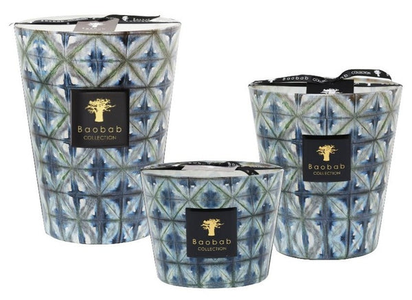 Three Baobab Collection Bohomania Kilan scented candles in varying sizes with a diamond pattern on blue and white glass containers.