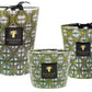 Three decorative Baobab Collection Bohomania Lazlo candles with green and white geometric patterns on their surfaces.