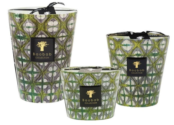 Three decorative Baobab Collection Bohomania Lazlo candles with green and white geometric patterns on their surfaces.