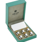 A green Ercuis box containing six silver Pineapple Placecard Holders with gold accents and a white card.