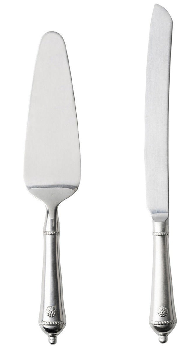 The Juliska Berry & Thread Cake Knife and Server set gleams side by side on a white backdrop, capturing the timeless elegance of an heirloom piece.