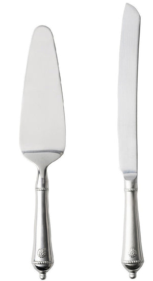 The Juliska Berry & Thread Cake Knife and Server set gleams side by side on a white backdrop, capturing the timeless elegance of an heirloom piece.
