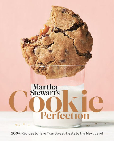 Cookbook cover featuring a large chocolate chip cookie with a bite taken out, resting on a glass, titled "Common Ground's Cookie Perfection" with text promising over 100 decorative cookie recipes.