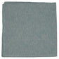 The Kimono Napkin Set by Deborah Rhodes features folded green napkins with a subtle zigzag pattern, inspired by Japanese print techniques.