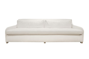 Introducing the Sophie Sofa by Verellen: a white, modern three-seater with two large seat cushions and a low, curved backrest. This bench-crafted piece promises both style and comfort with its Perennials Old Hand Blanca fabric.