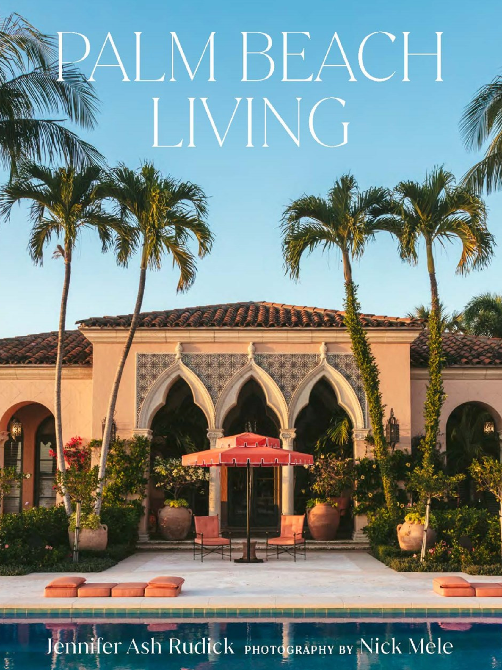The cover of Palm Beach Living by Vendome features a Mediterranean-style villa with arched windows, palm trees, and a pool, showcasing tropical living through top interior designers.